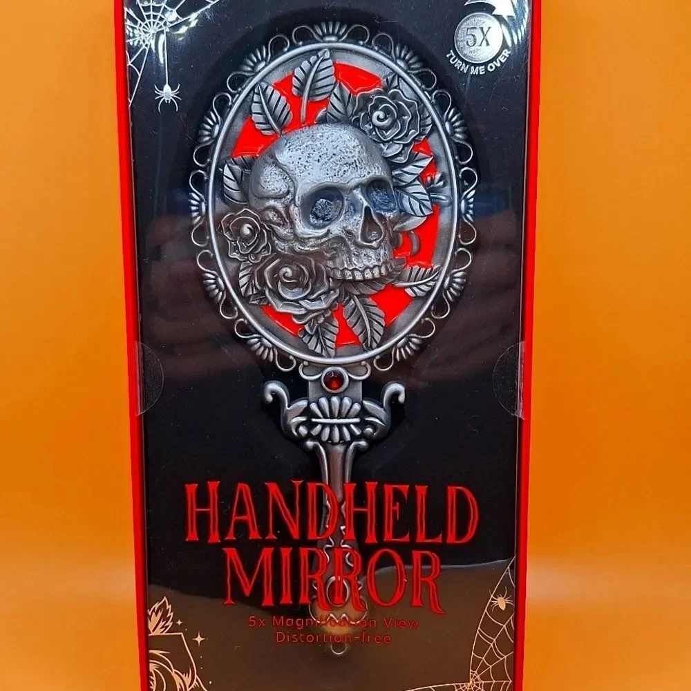 Skull magnifying handheld mirror